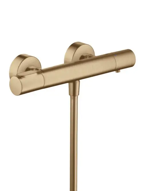Thermostatarmatur von AXOR in brushed bronze mit zwei Temperaturreglern und einem zentralen Wasserablauf, geeignet für eine Wandmontage.